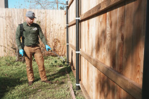 tech spraying backyard for spider control Spokane, WA