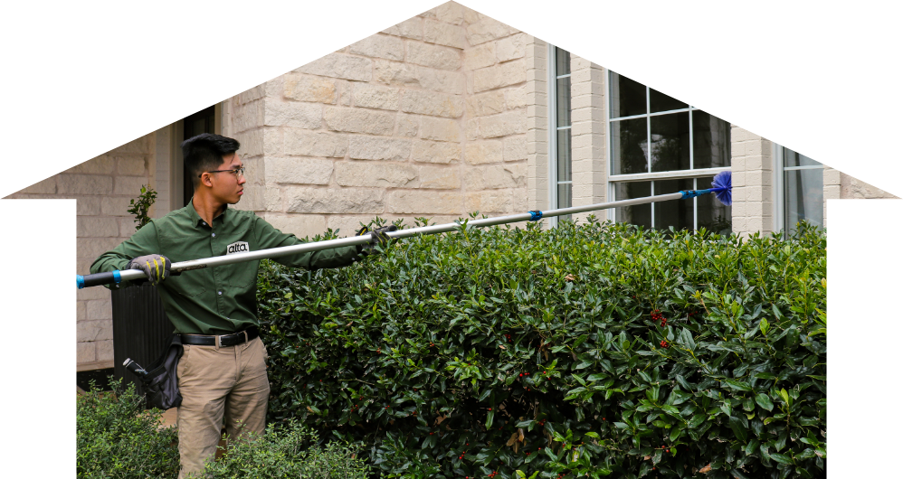 pest control technician doing home pest control services