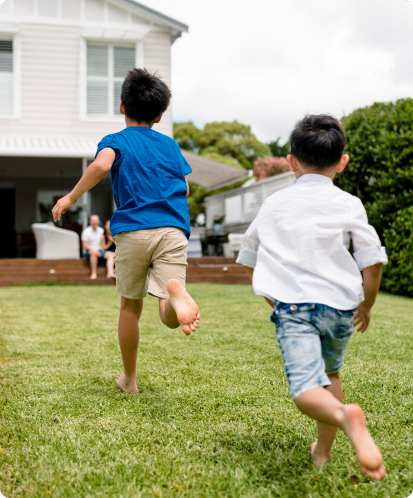 kids running in a backyard with no ant hills
